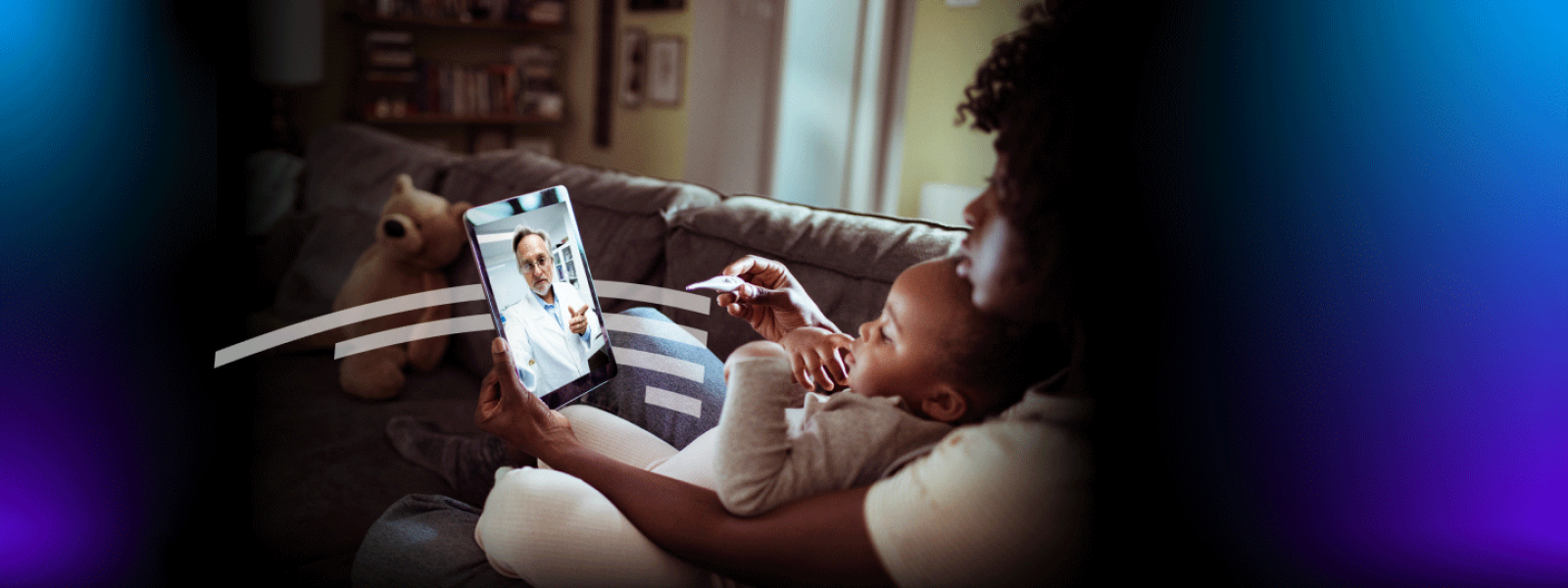 Woman with toddler attending virtual appointment