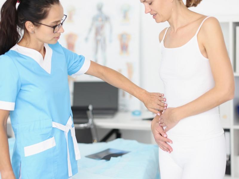 Doctor Examining Women Patient for Appendicitis 