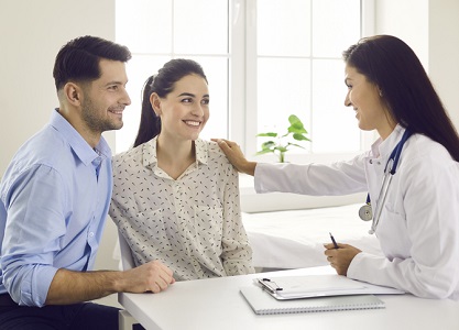 Young couple counseling with female doctor