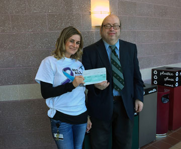 Brandy Brown, recently presented a check to Sam Levy of NAMI’s Cumberland County Chapter.