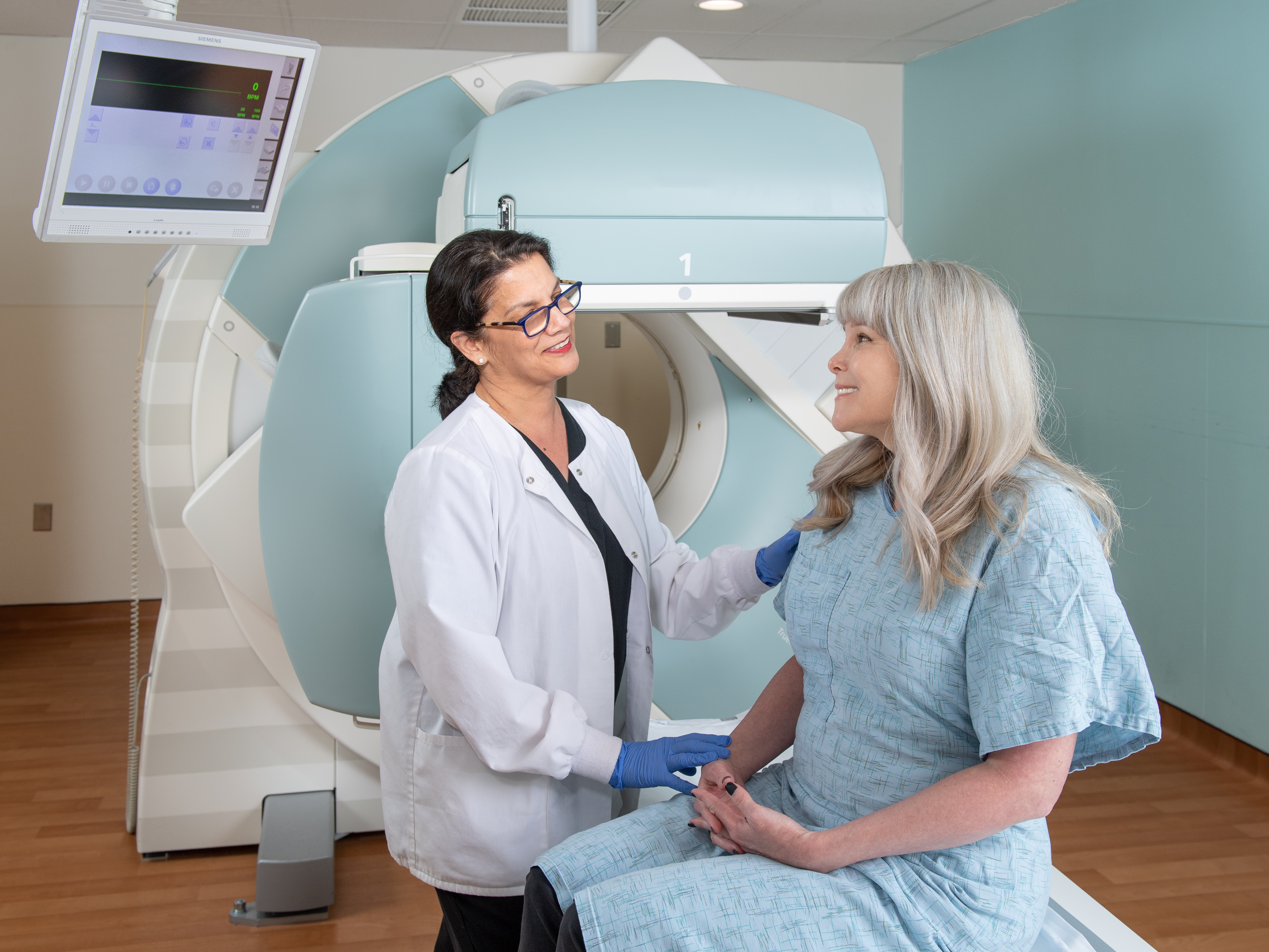 physician preparing patient for imaging