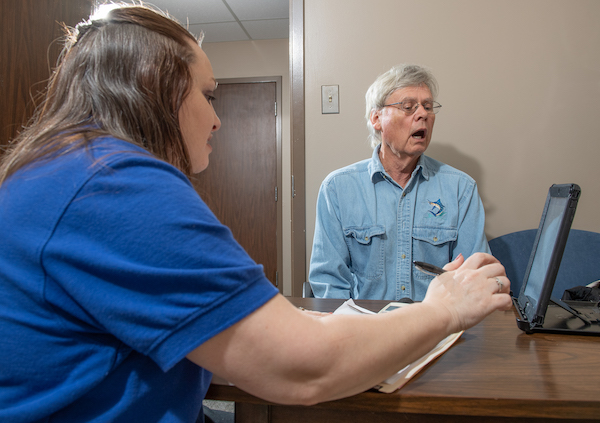 An Inspira nurse assisting a Parkinsons patient