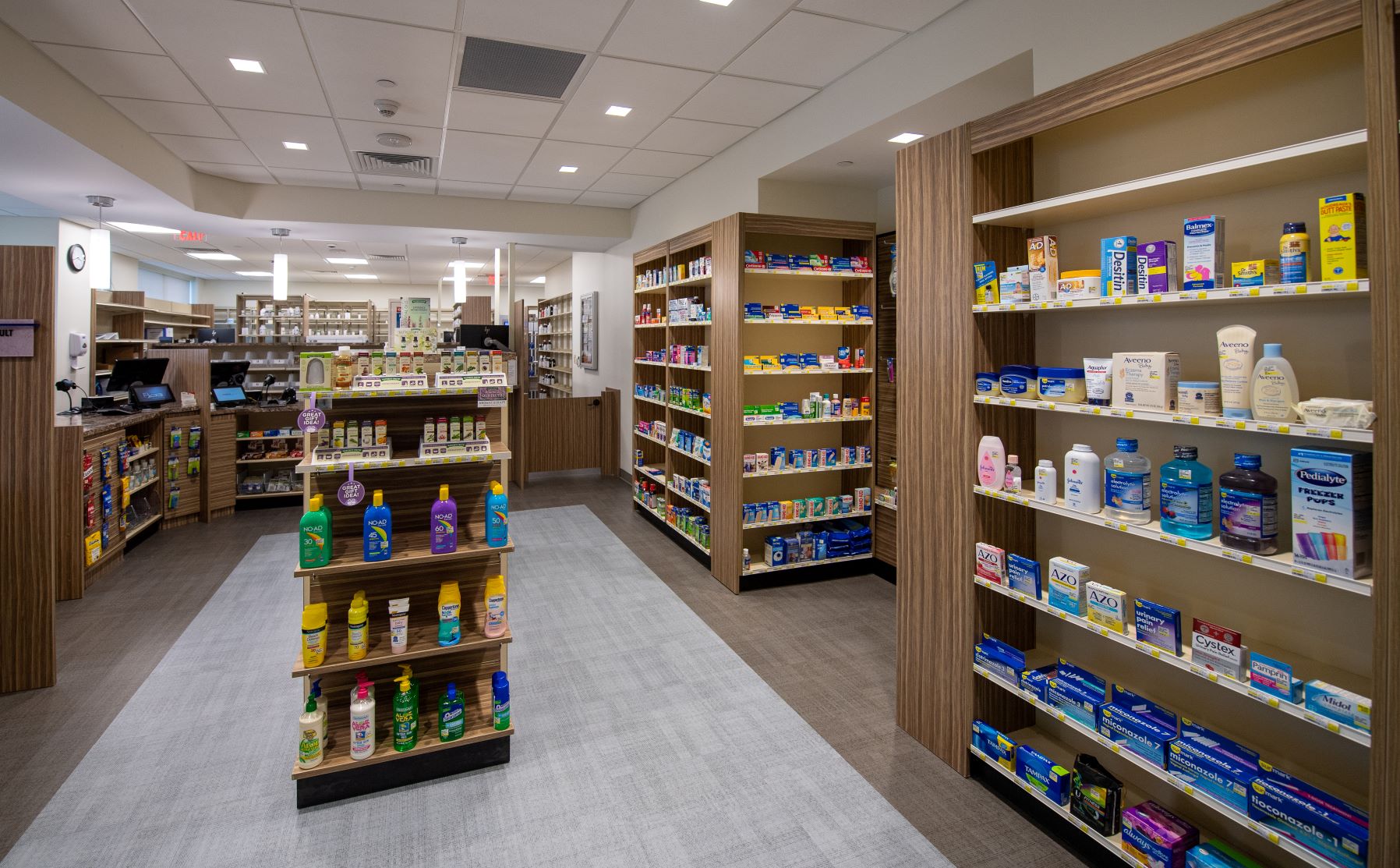 Inspira Retail Pharmacy interior shelving with products