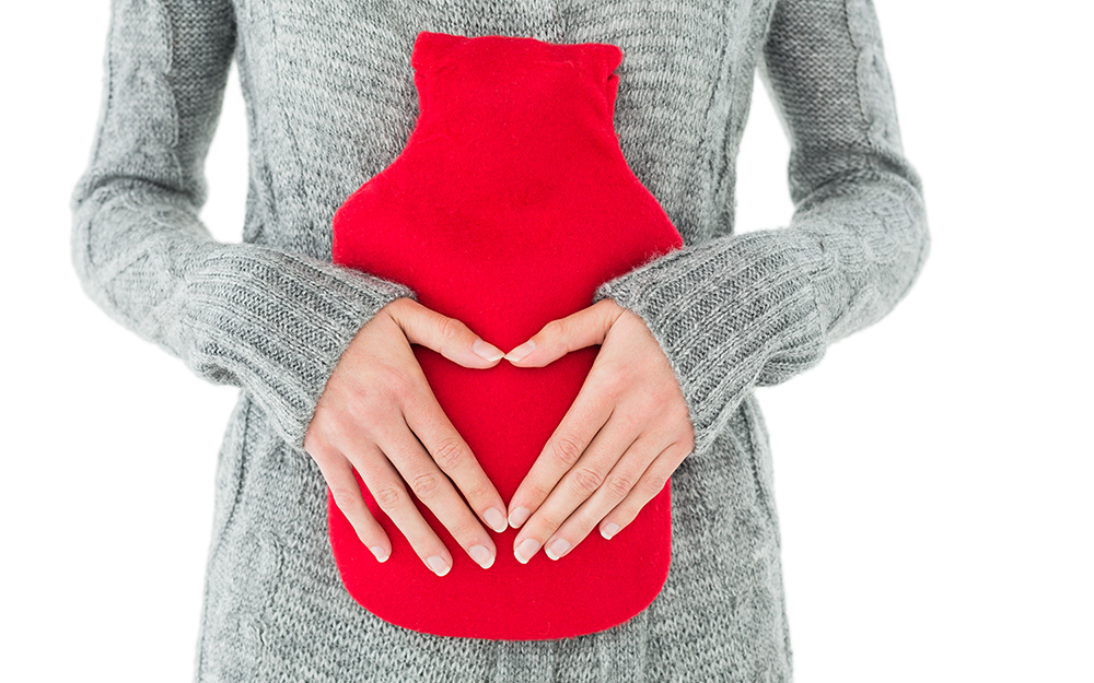 A woman suffering from gastrointestinal issues