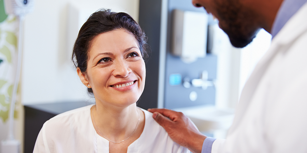 An Inspira doctor educating a woman on Hormone Replacement