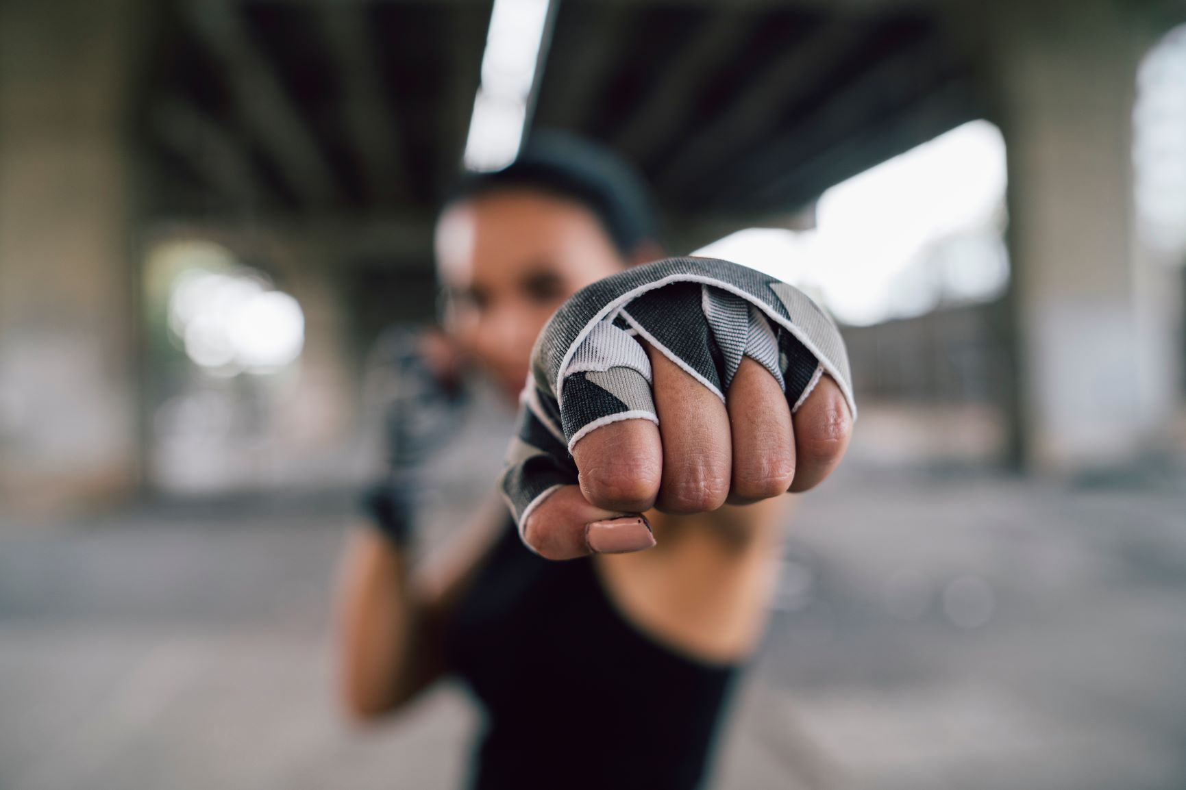Female fighter with wrapped hands