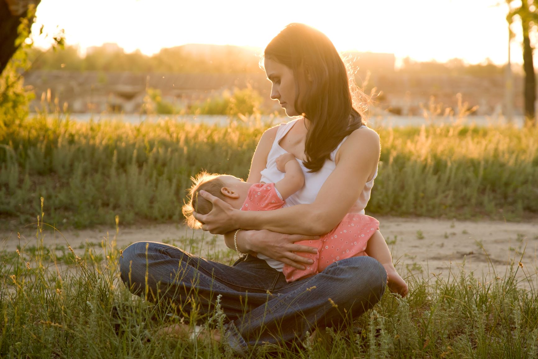 A woman breastfeeding her baby