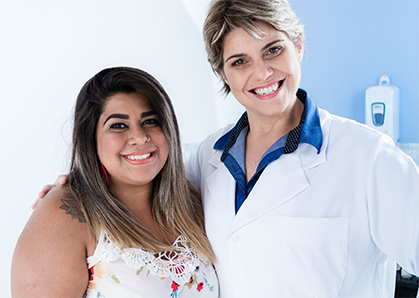 Female doctor standing next to another female