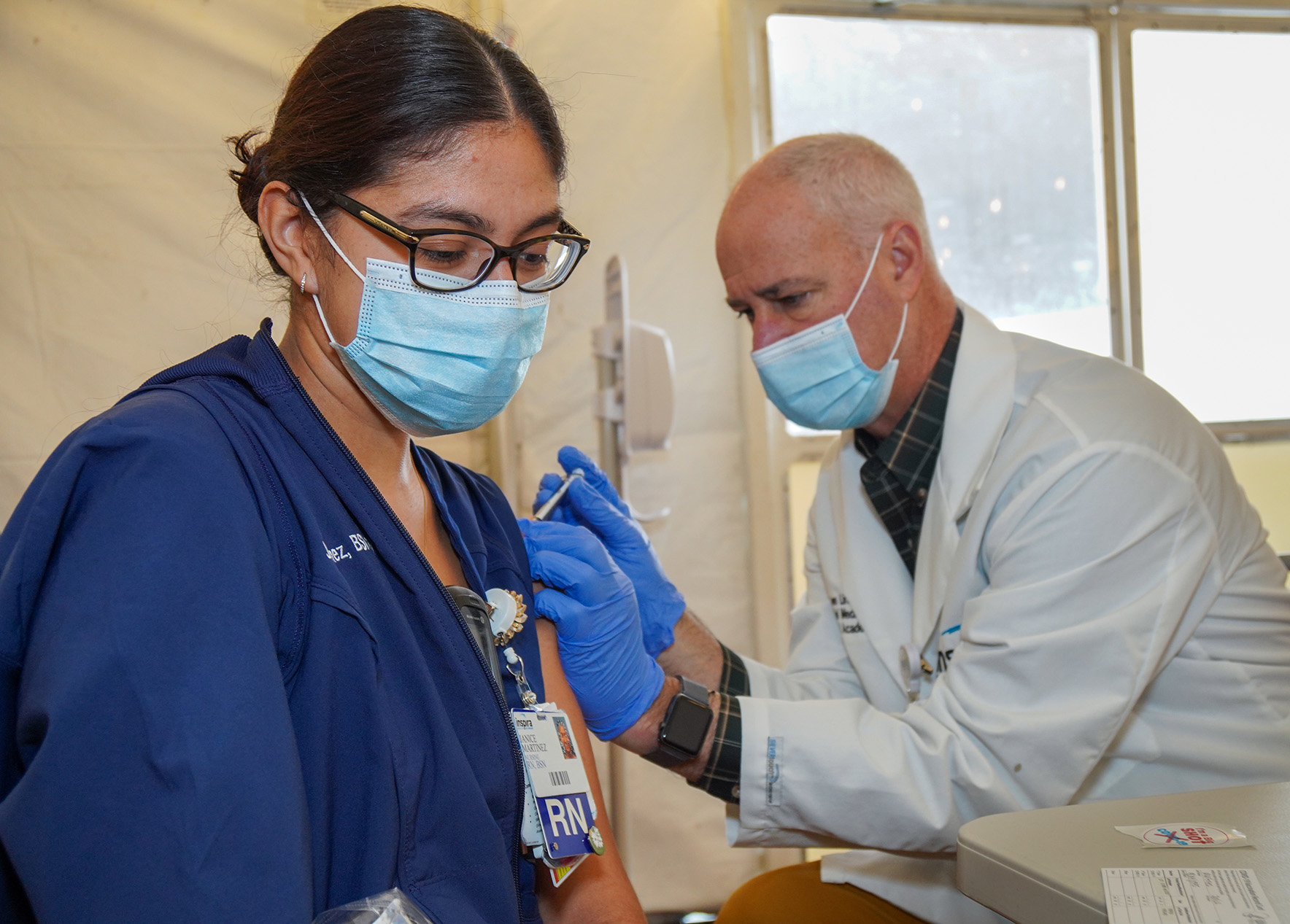 Inspira nurse receiving the COVID vaccine