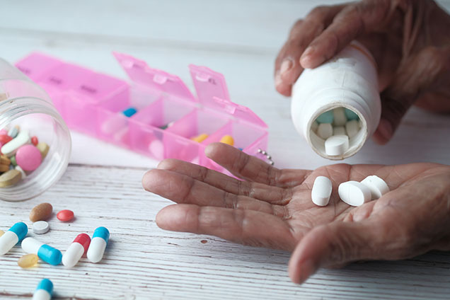 Pills and a pill bottle and a pill organizer