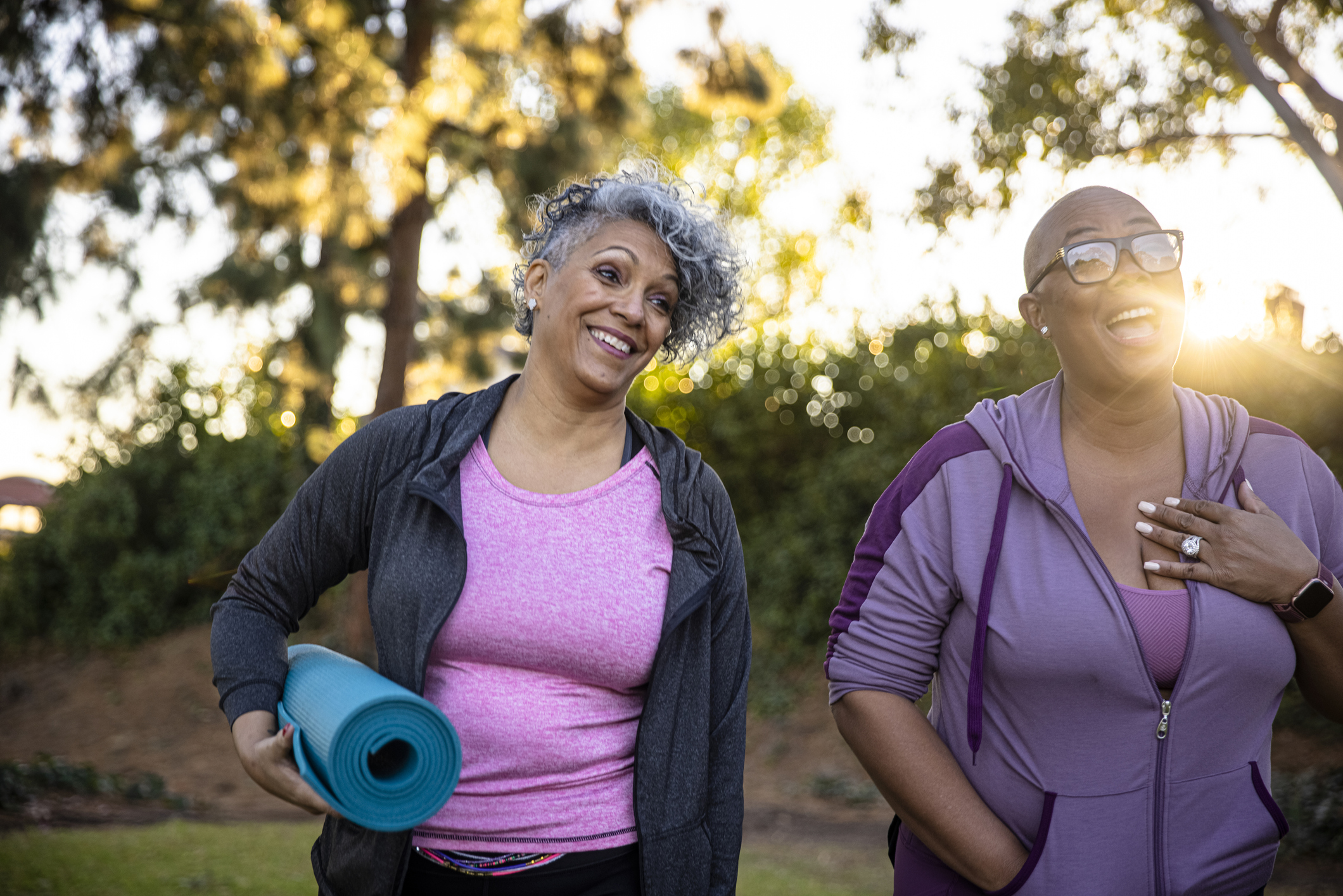 Women walking with yoga mat