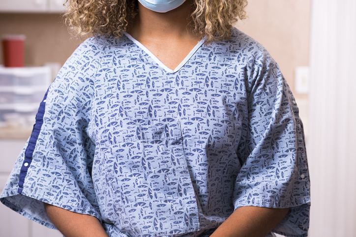 Women in Gown Preparing for a Mammogram 