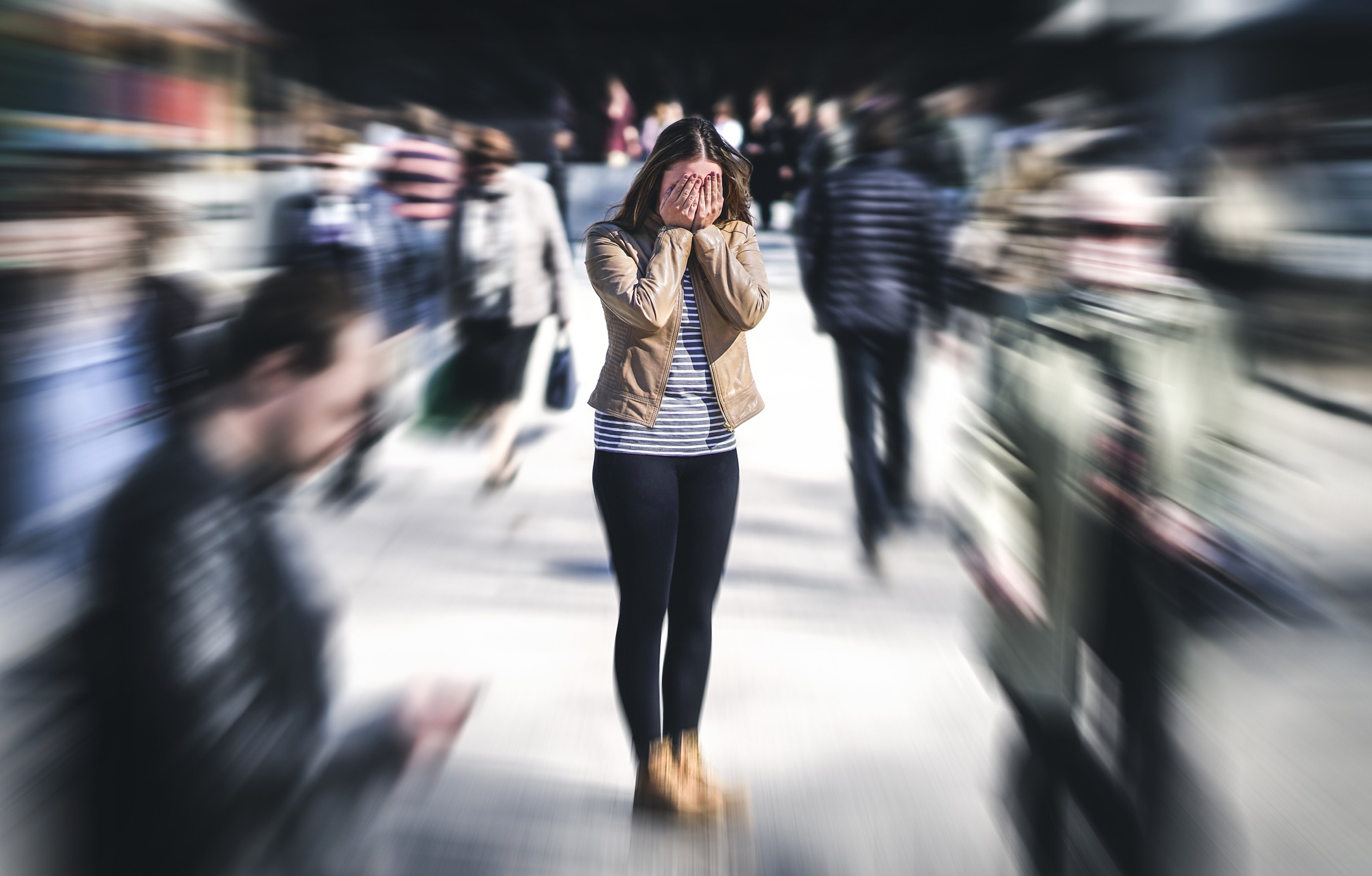 Woman having a panic attack in public place.