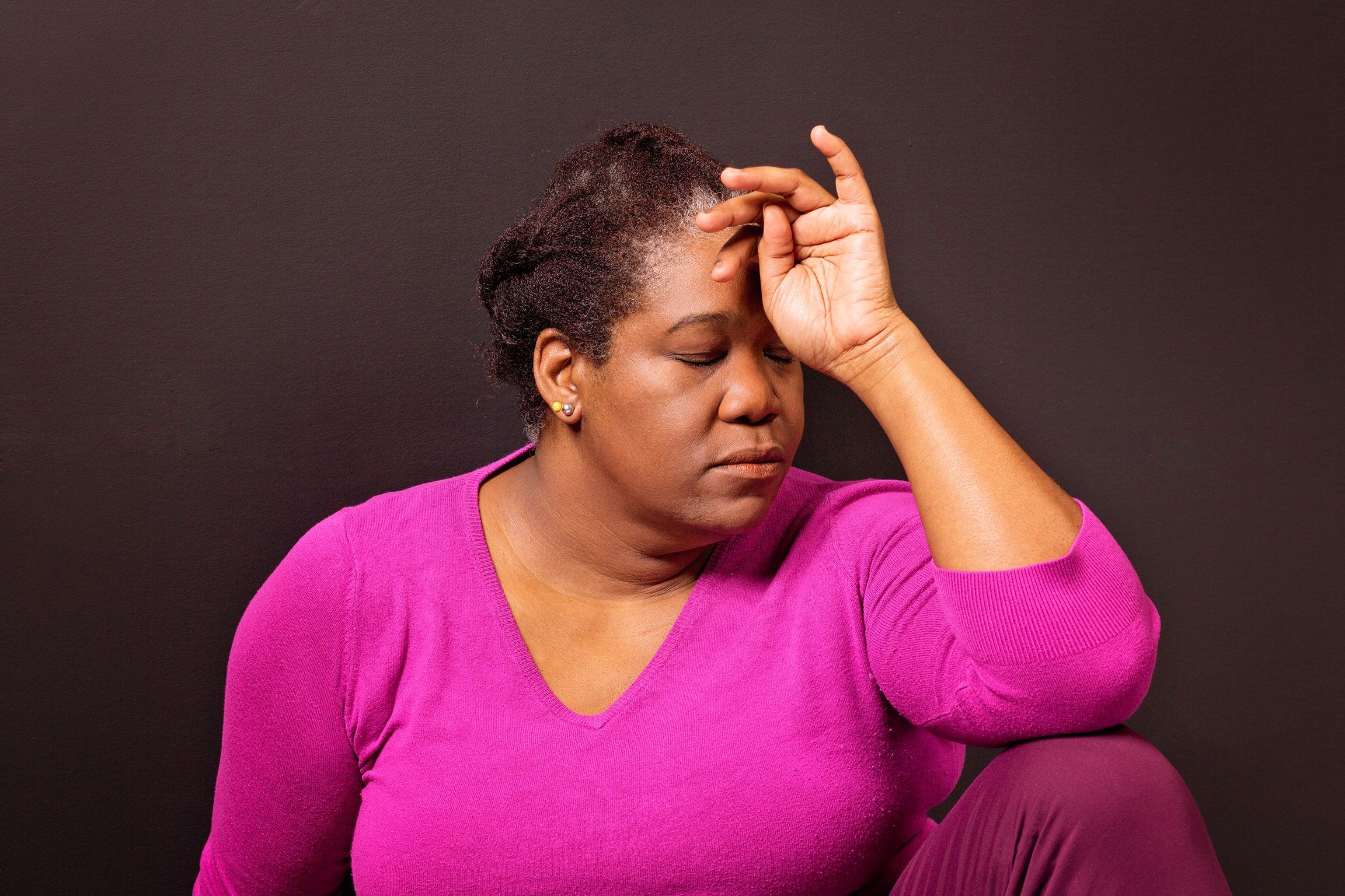 Mature black woman suffering from a splitting headache