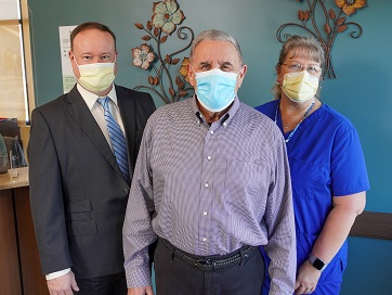 Chuck Pellegrini with Dr. Thomas McAndrew and medical assistant Adrienne Sindoni.