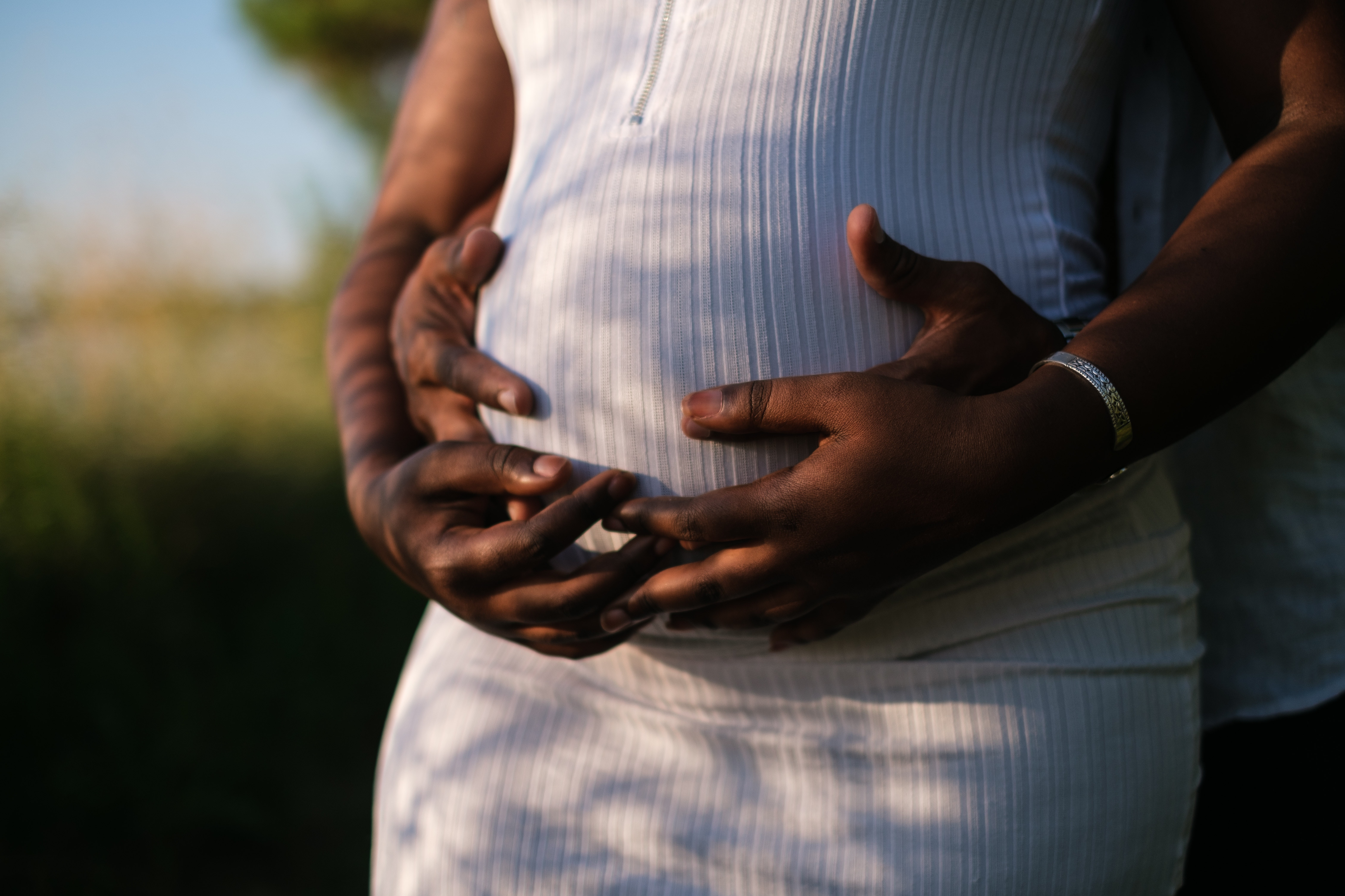 Woman embracing her baby bump