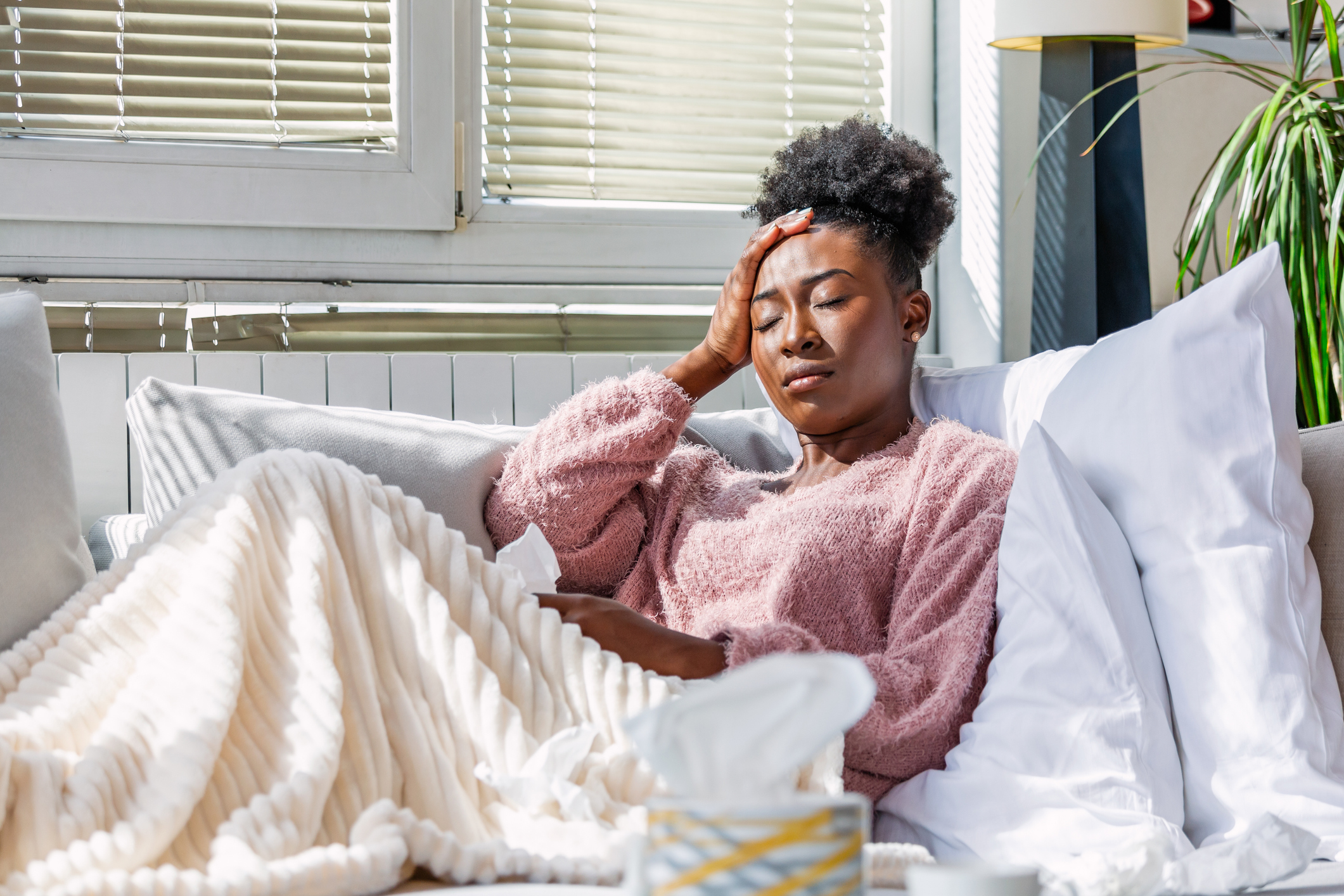 sick woman holding head