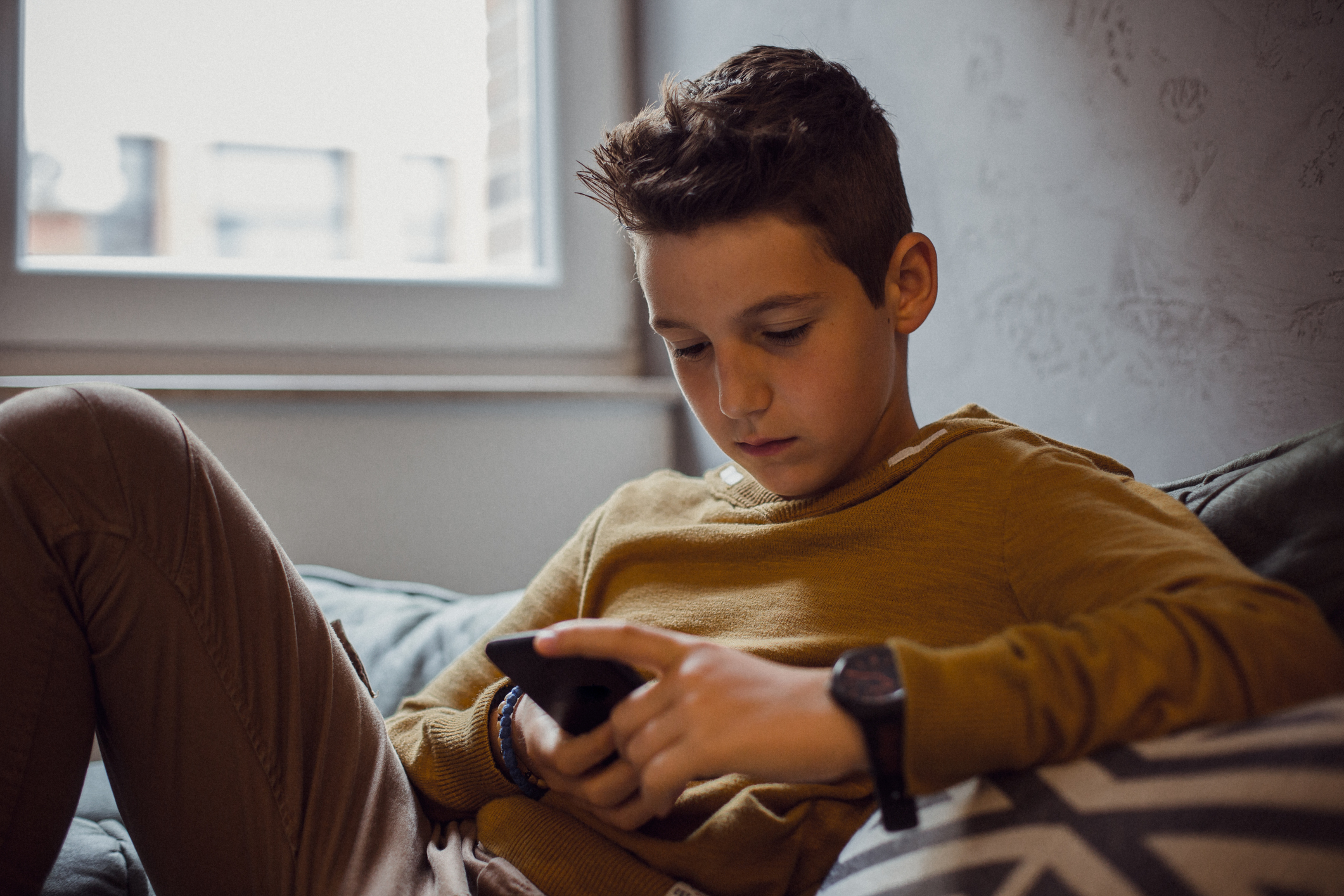 young teen on mobile phone