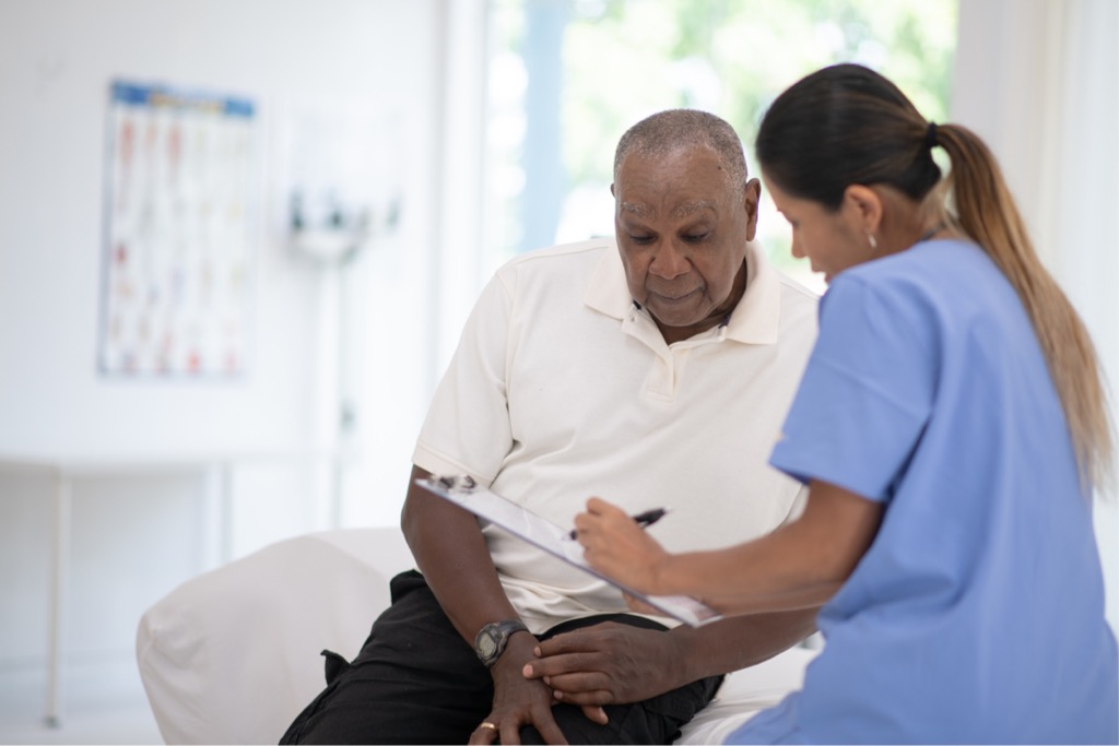 an-elderly-gentleman-in-his-doctors-office-receiving-a-checkup