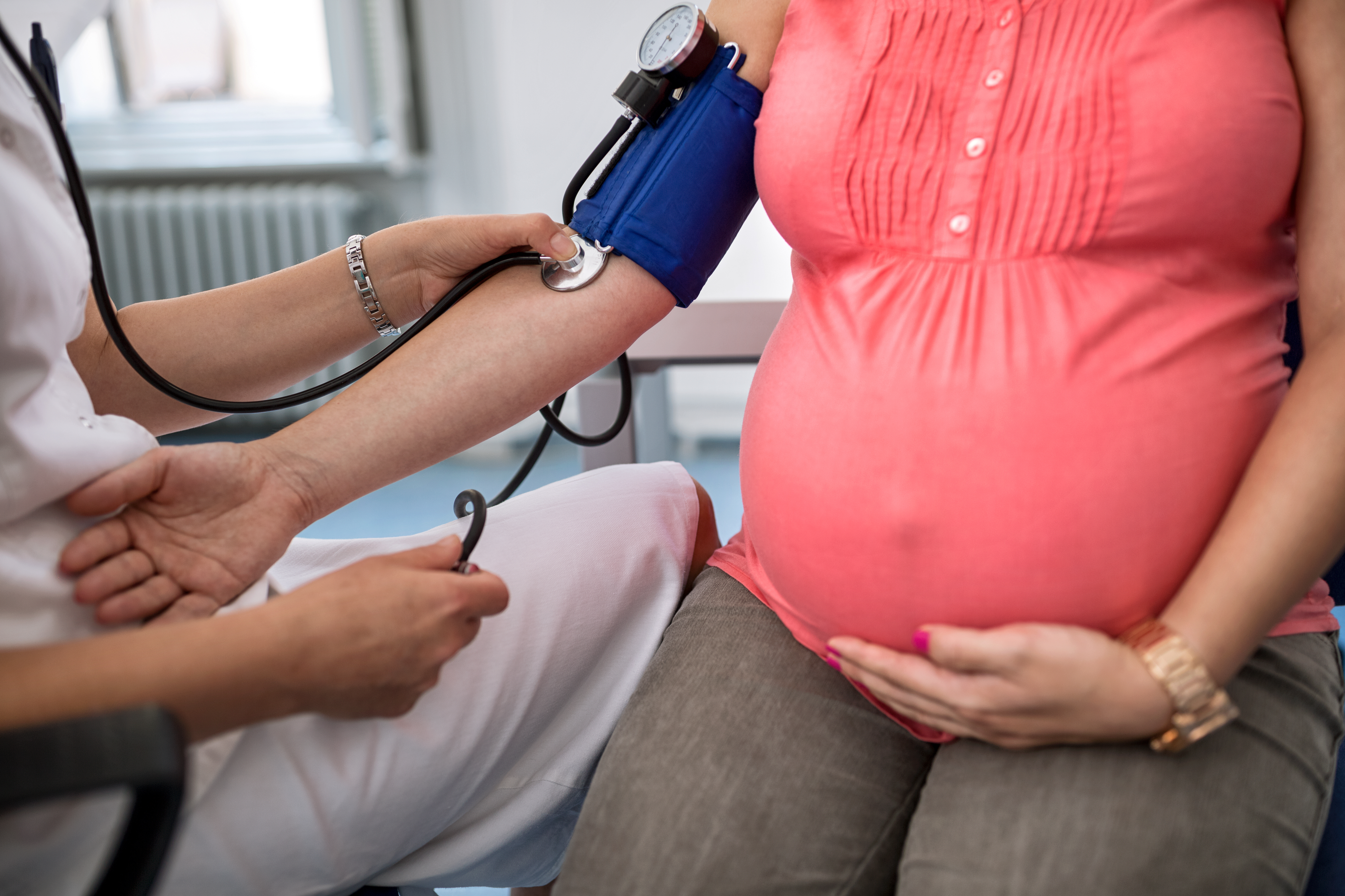 pregnant mother getting bp checked