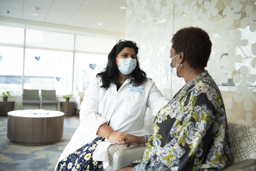 Dr.Kulkarny with a Patient Sitting