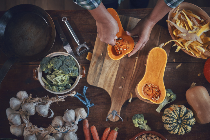 Preparing Pumpkin Stew with Carrots, Broccoli and Spinach