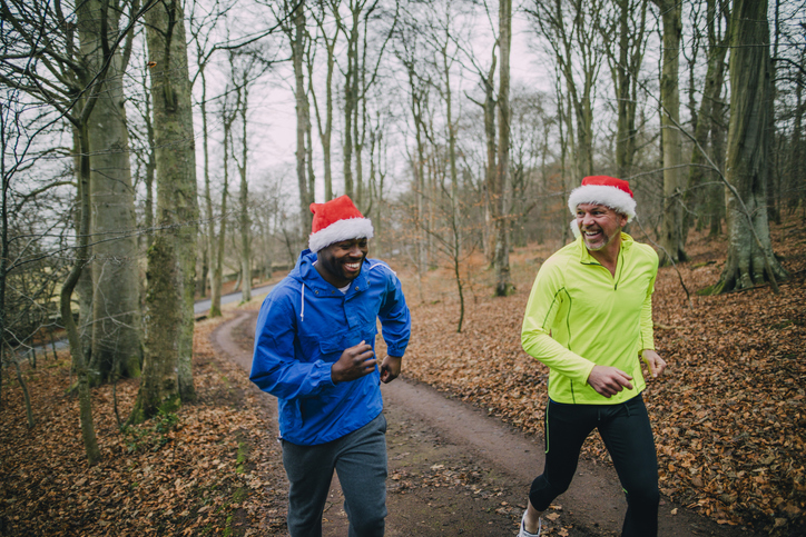 Two friends jogging up the trails in the forest to get fit in the middle of December!