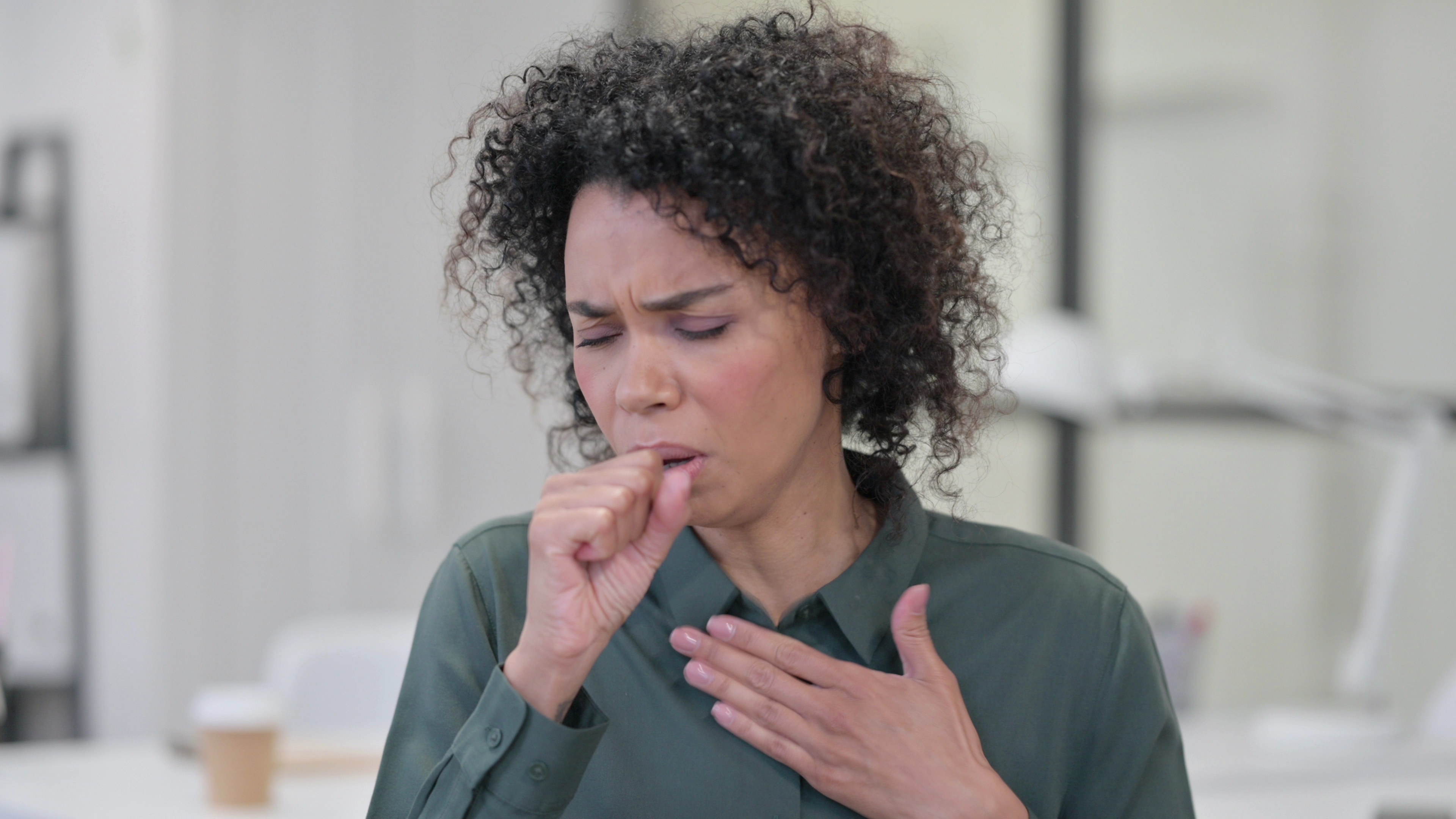 Portrait of Sick Young African Woman Coughing