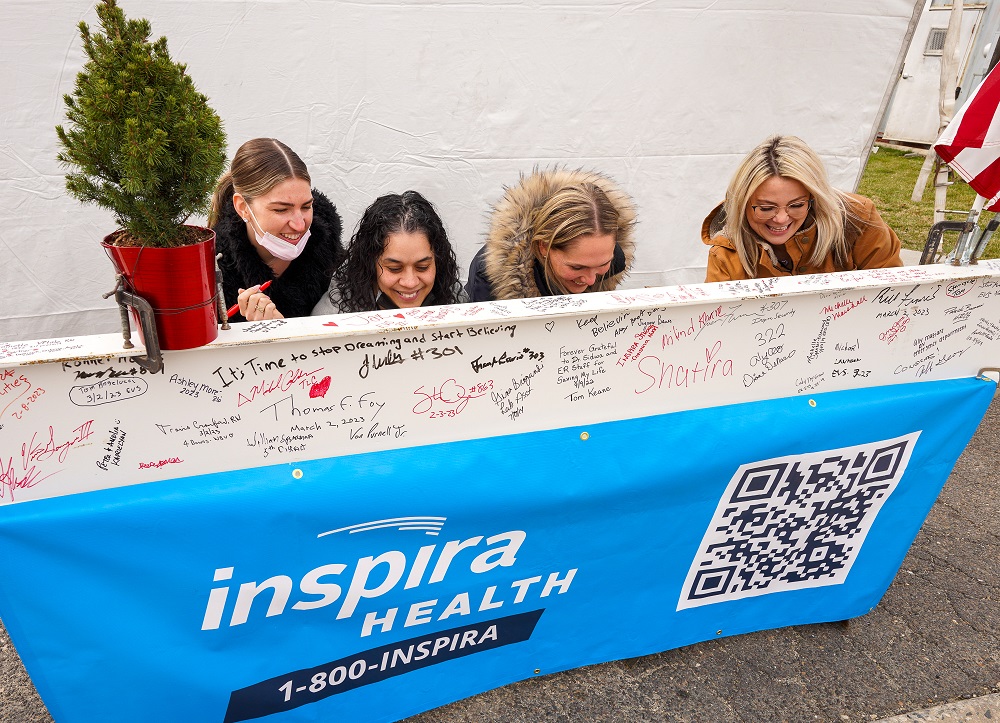 Inspira Health employees, along with state, county and municipal officials, signed the final steel beam at the Topping Off Ceremony on Inspira Health’s Woodbury campus.