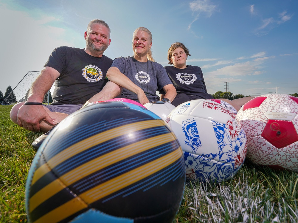 Shelly Carrozza-Voros and her Family playing Soccer