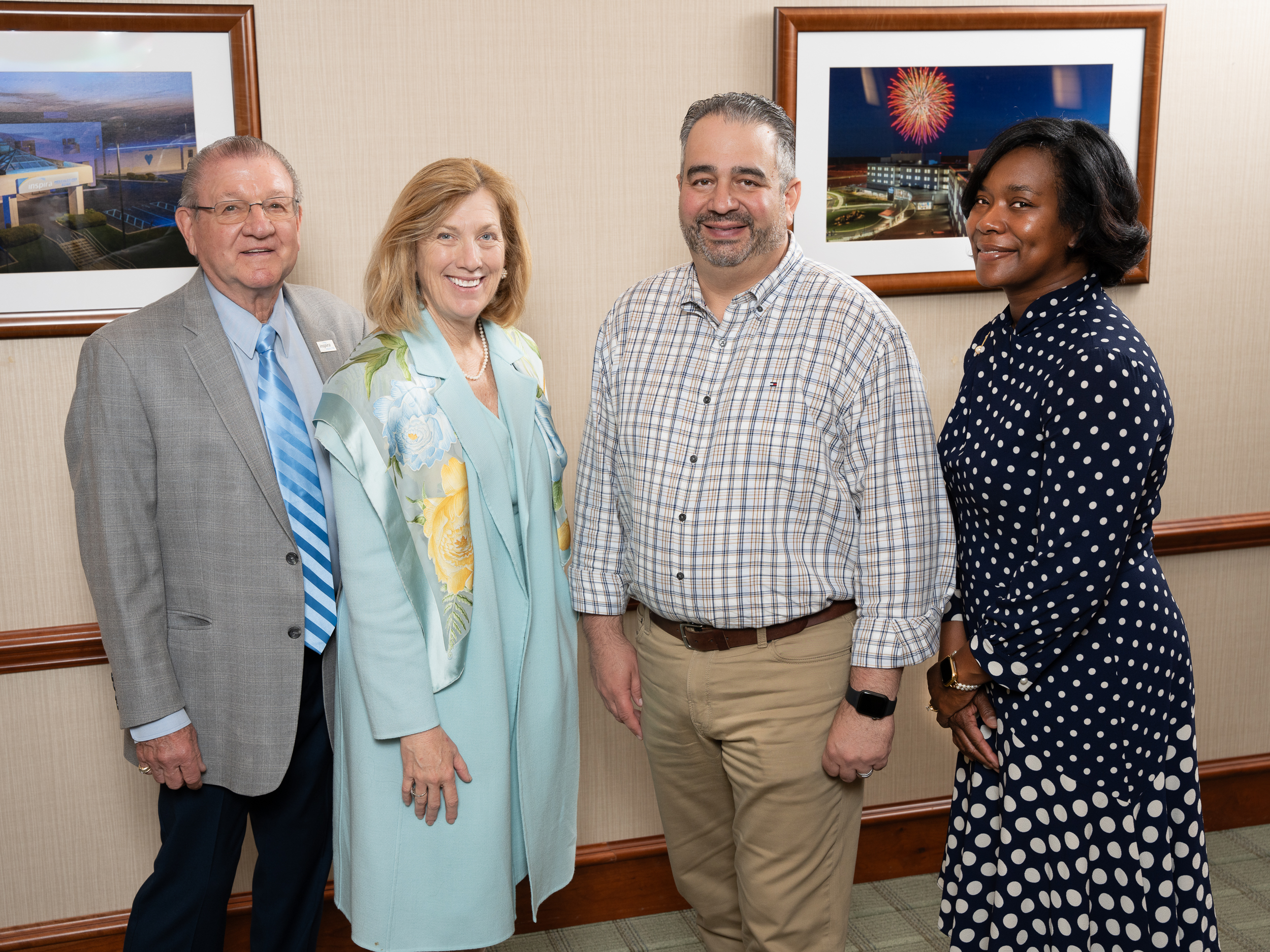 Four senior people standing