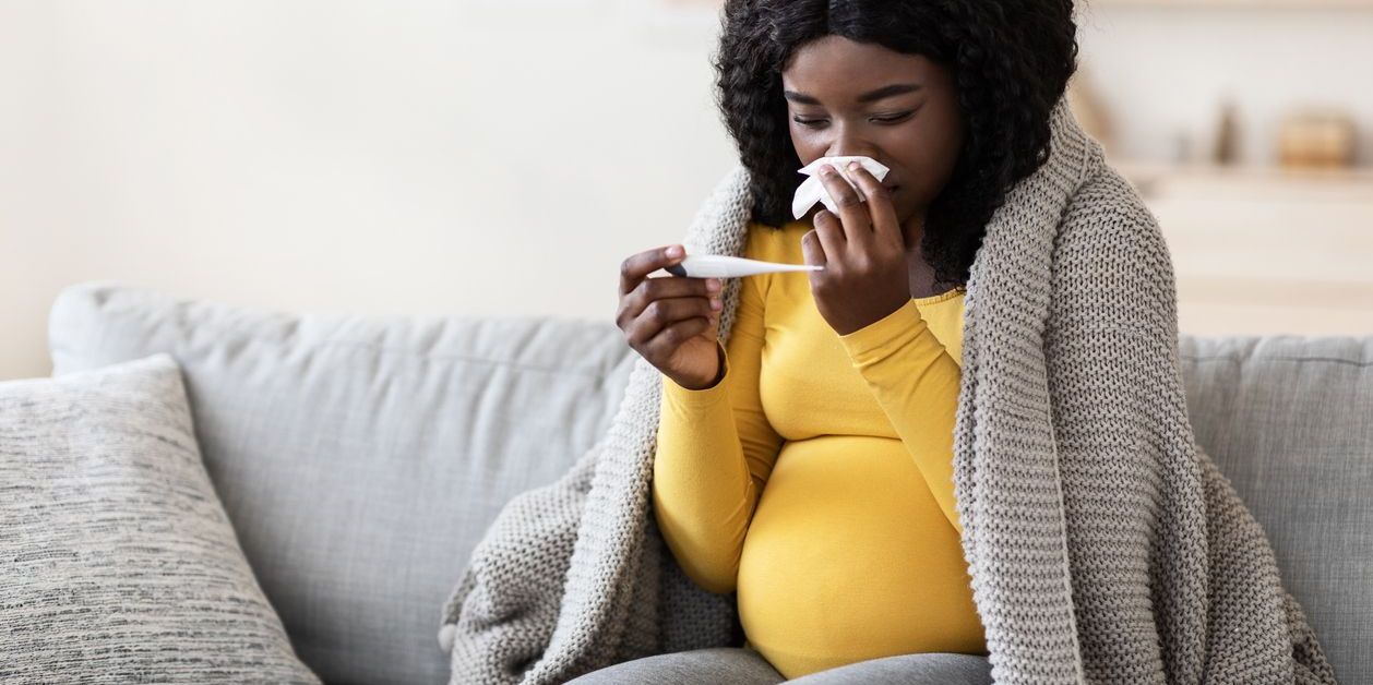 Pregnant Woman testing for cold and fever