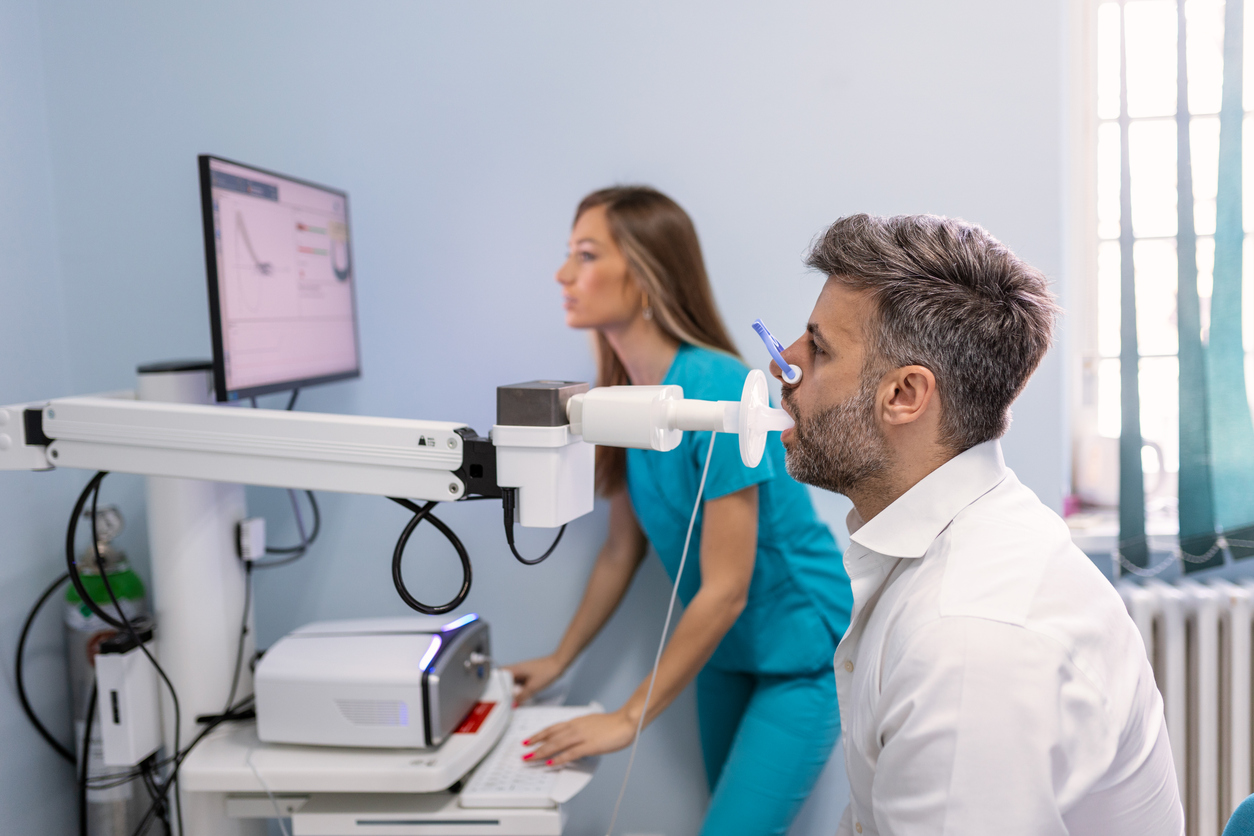 man taking spirometry test for COPD conditions in hospital