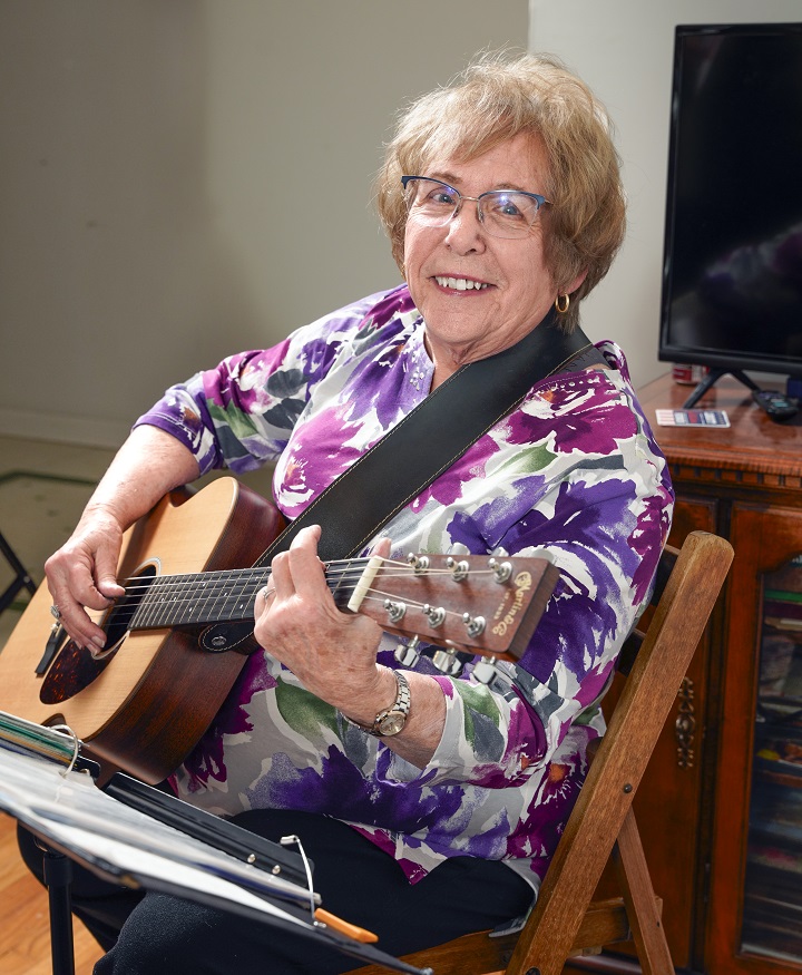 Portrait shot of a women with guitar
