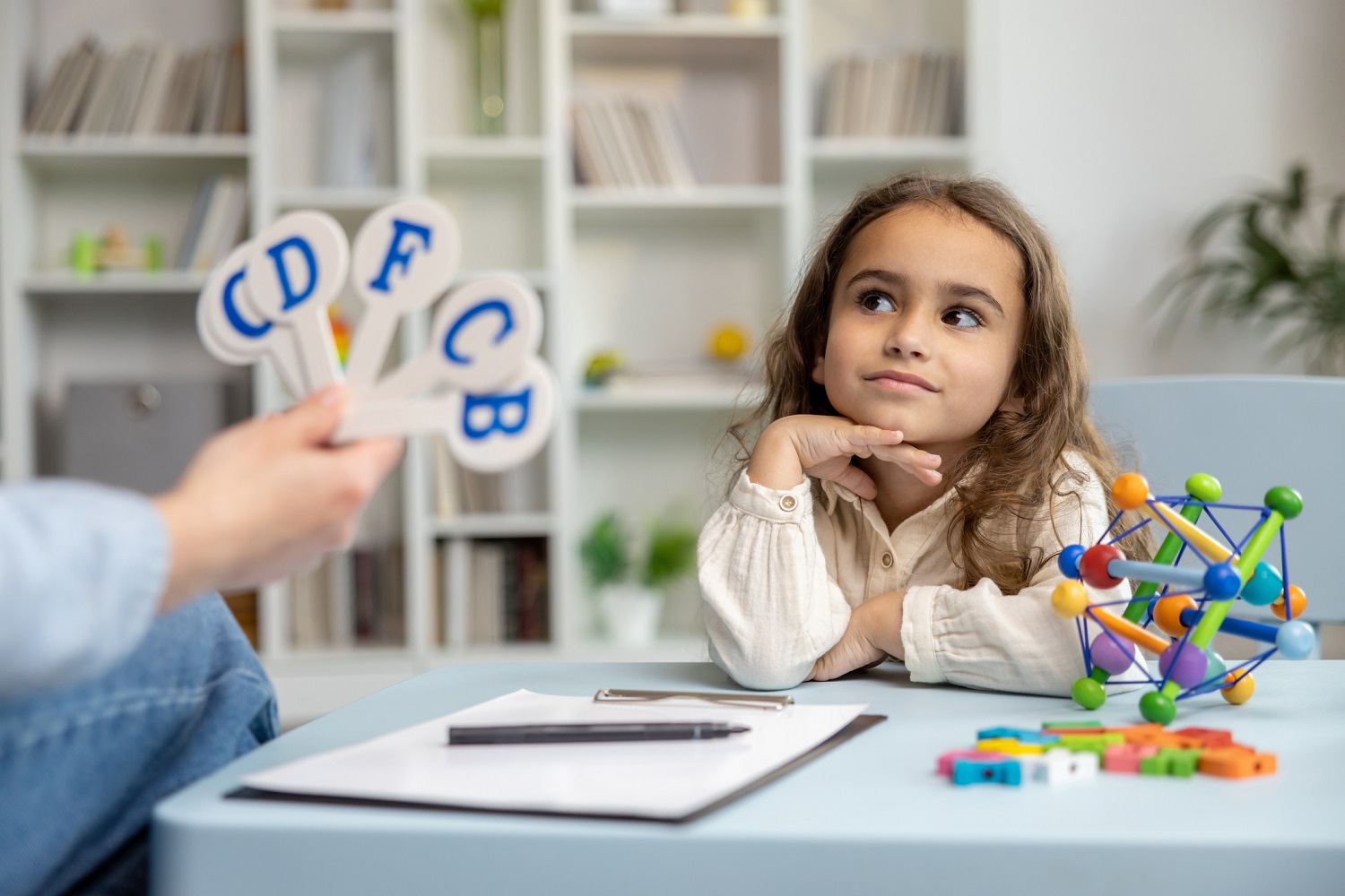 Kid looking at alphabets