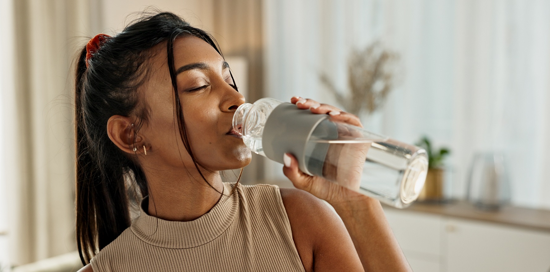 Woman drinking water from bottle
