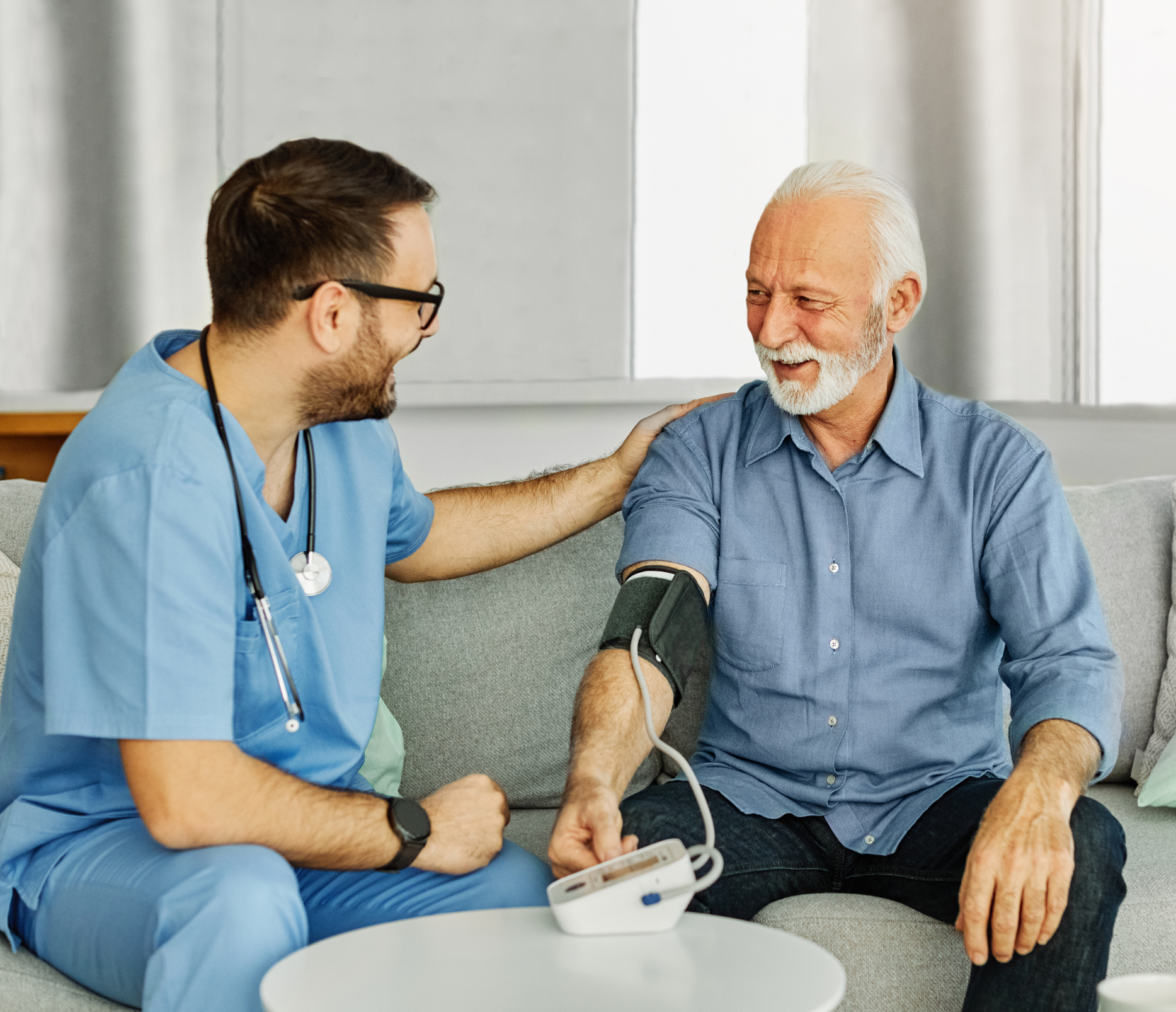 Doctor checking patient's blood pressure  