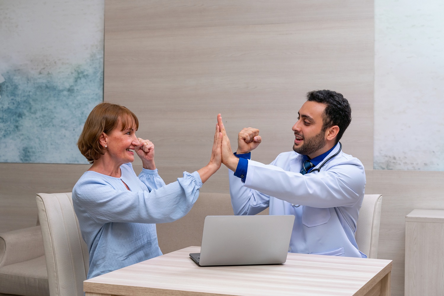 doctor and patient doing high-five