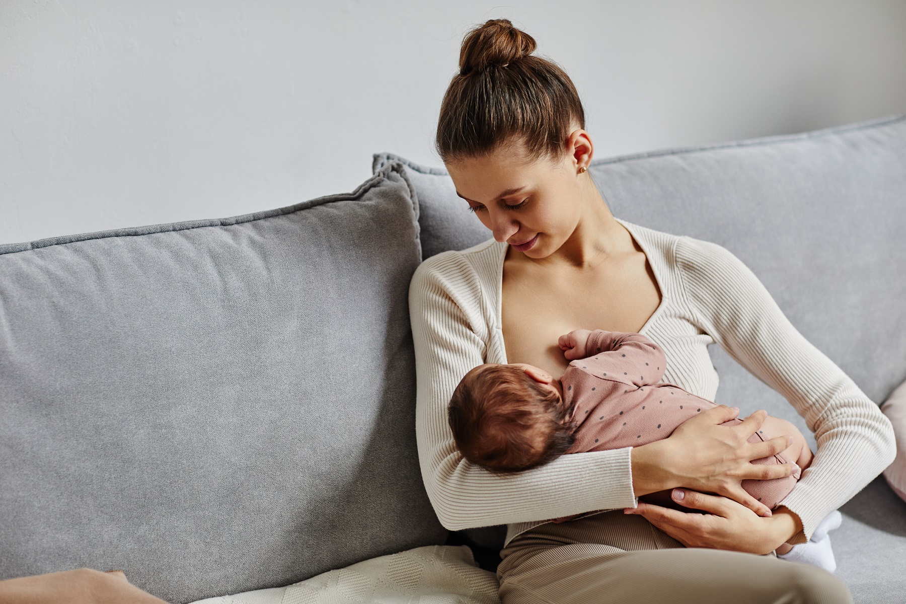 Woman breastfeeding new born