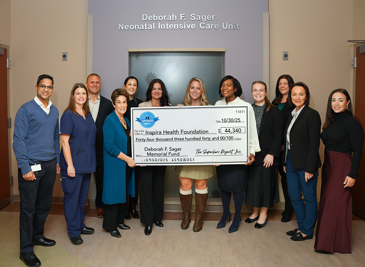 Group picture with donation check