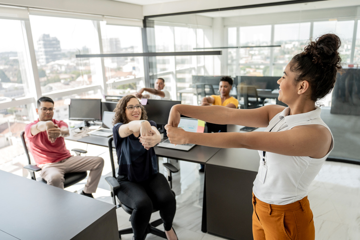 therapist doing health workshop with employees