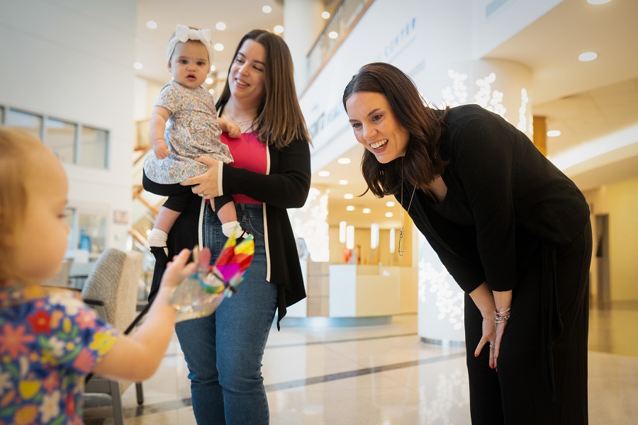 two young women playing with kids 
