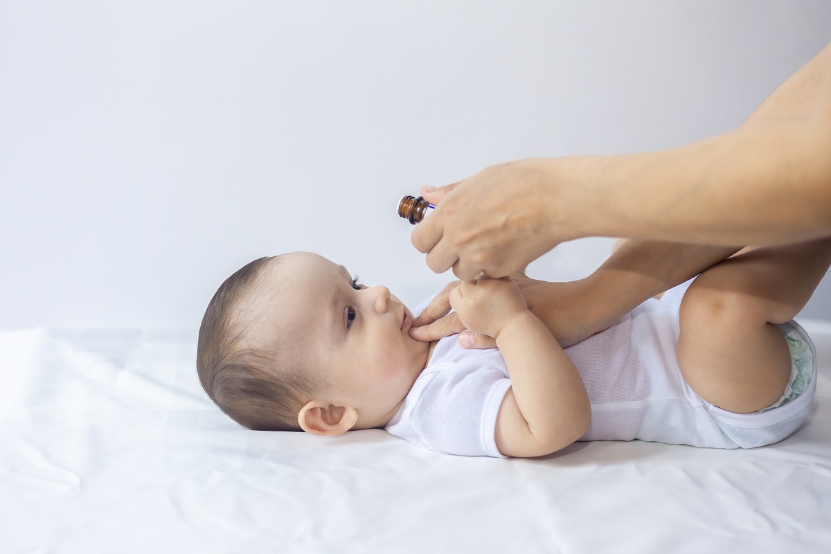 infant baby drinking medicine