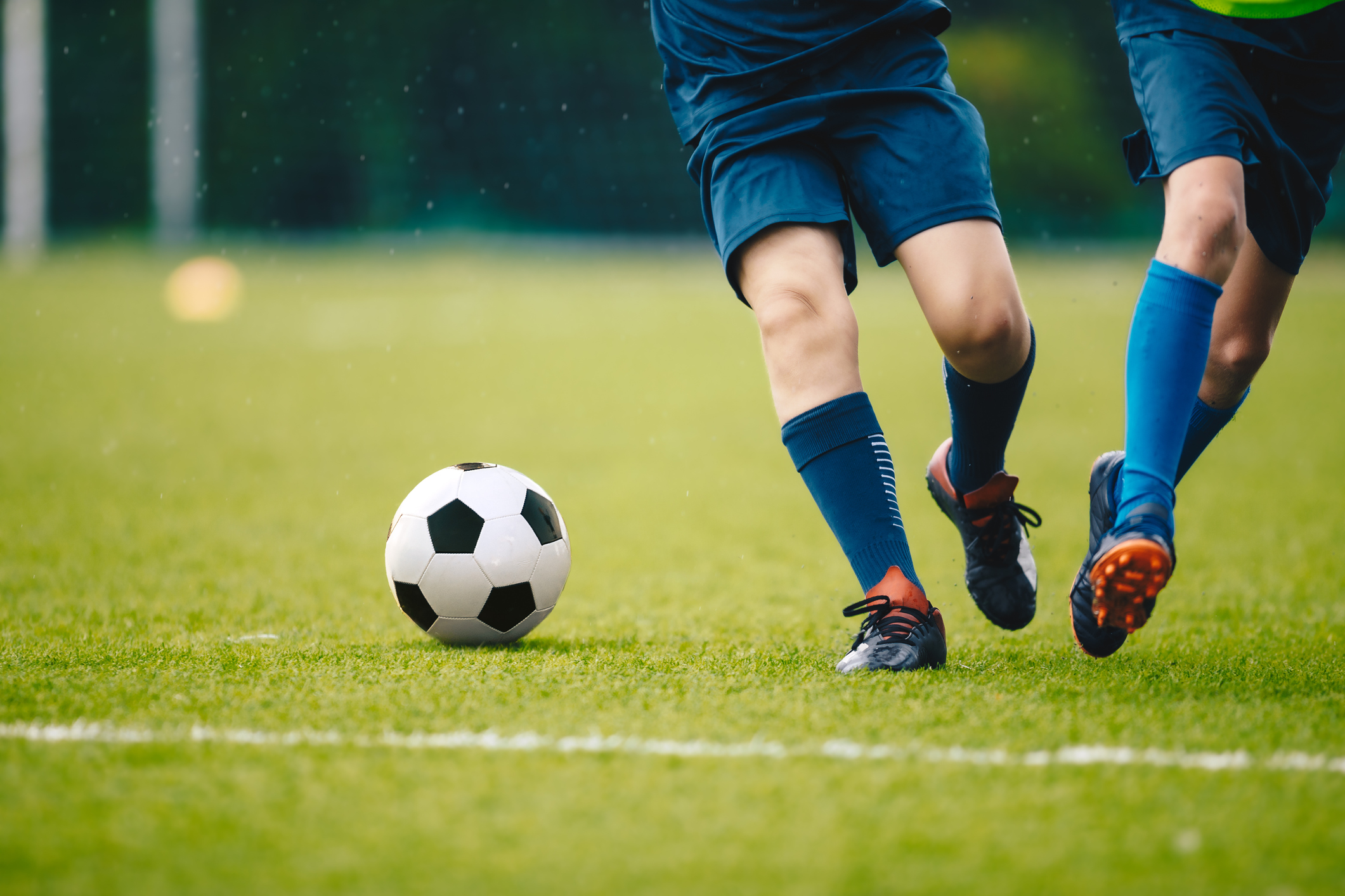 two young men playing football