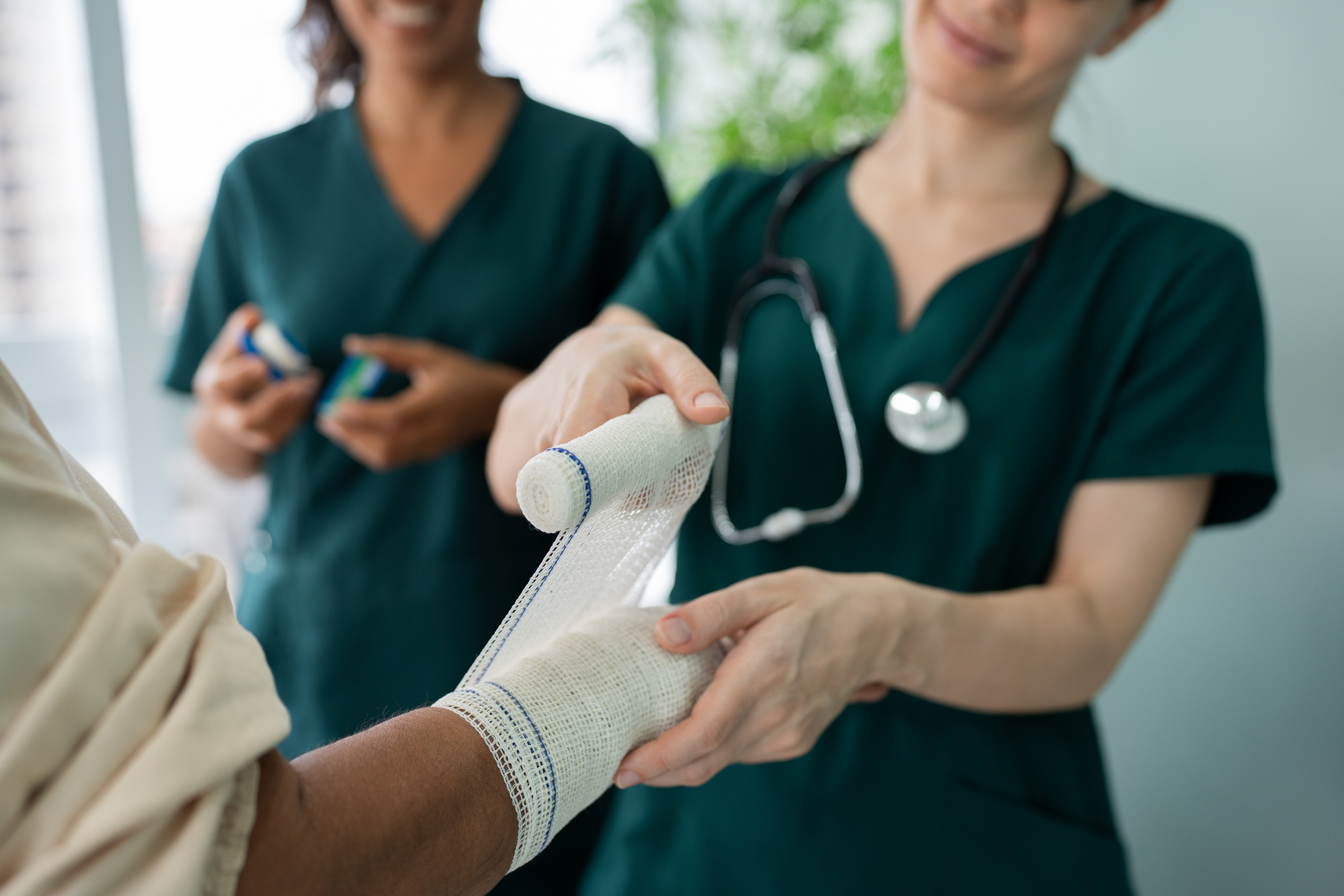 nurse dressing patients wound