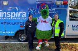Inspira Health EMTs with the Philly Phanatic in front of an Ambulance