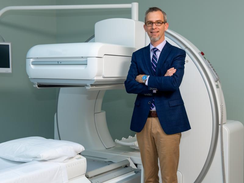 doctor tubb standing in front of an imaging device