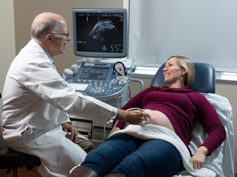 Prenatal exam Doctor with patient doing an ultrasound