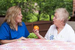 Speech therapist with female stroke patient