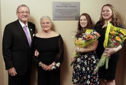 One Senior Couple with Two Ladies Holding Flowers